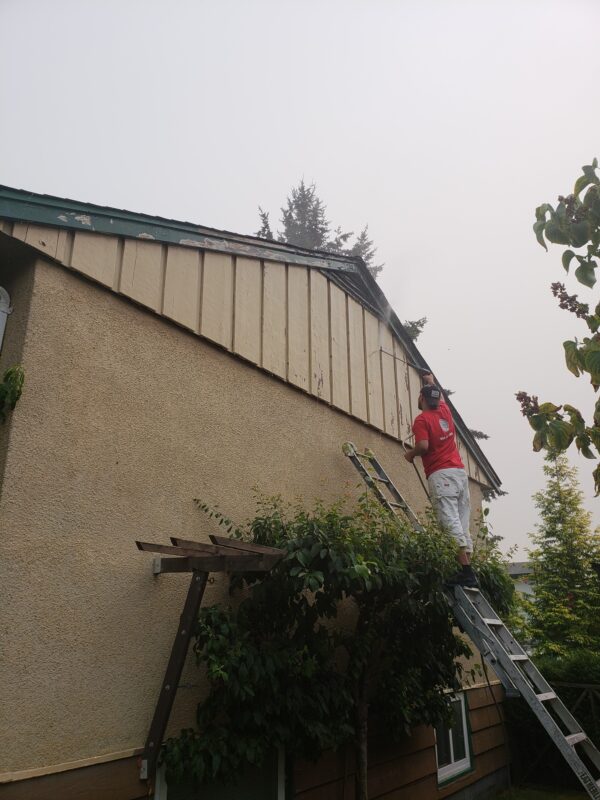 Power washing before painting your home’s exterior.