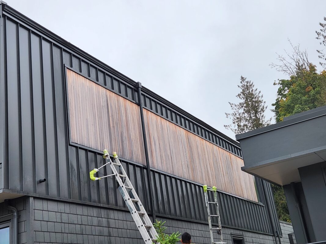 Power washing before painting your home’s exterior.