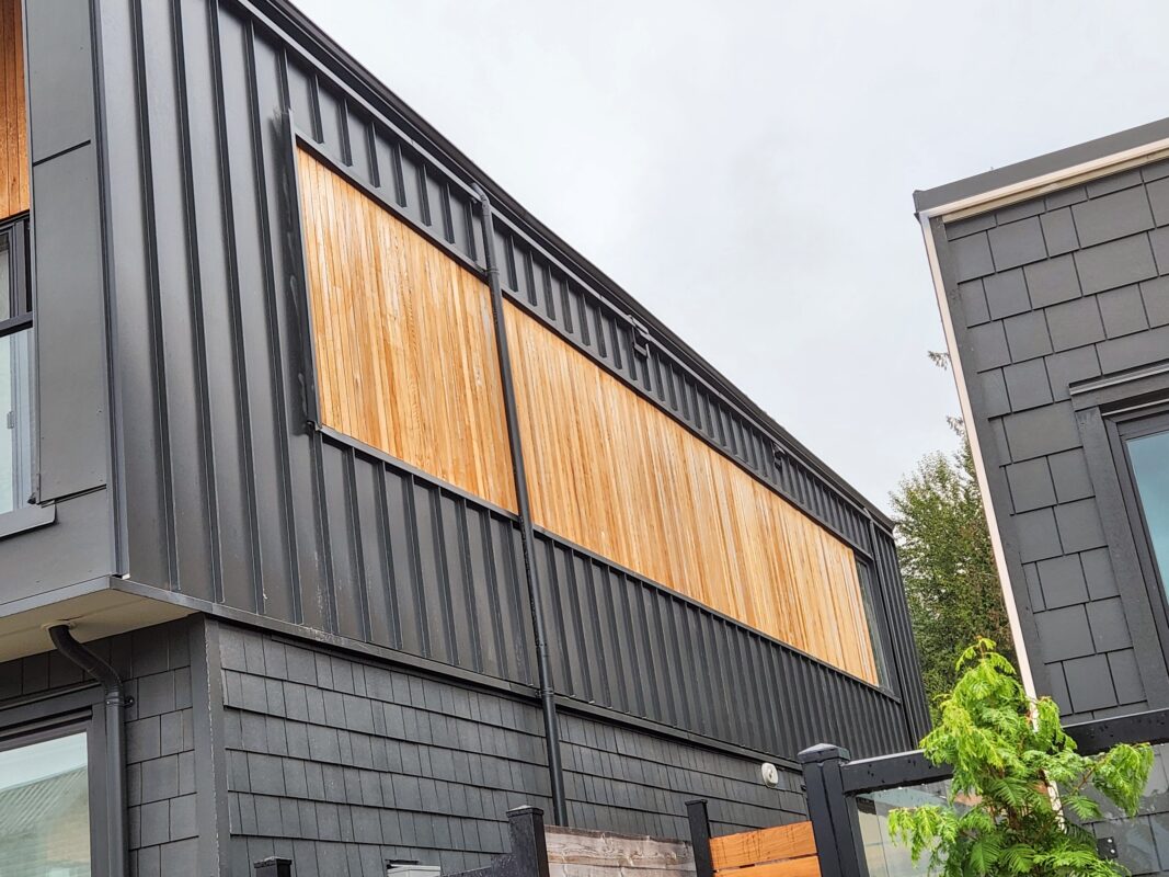 Power washing before painting your home’s exterior.