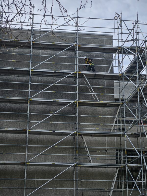 Power washing before painting your home’s exterior.