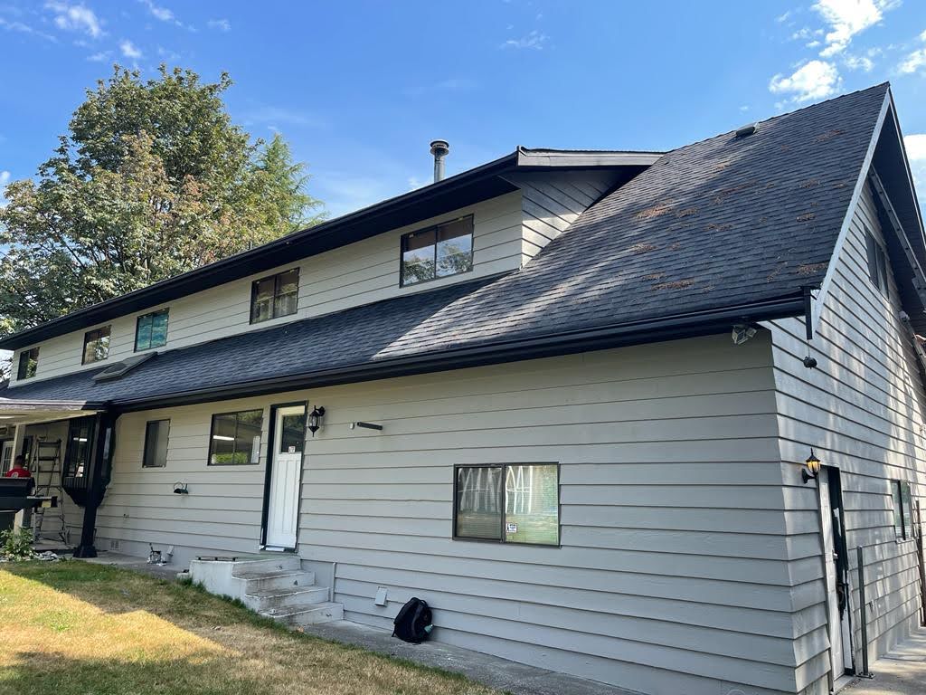 Power washing before painting your home’s exterior.